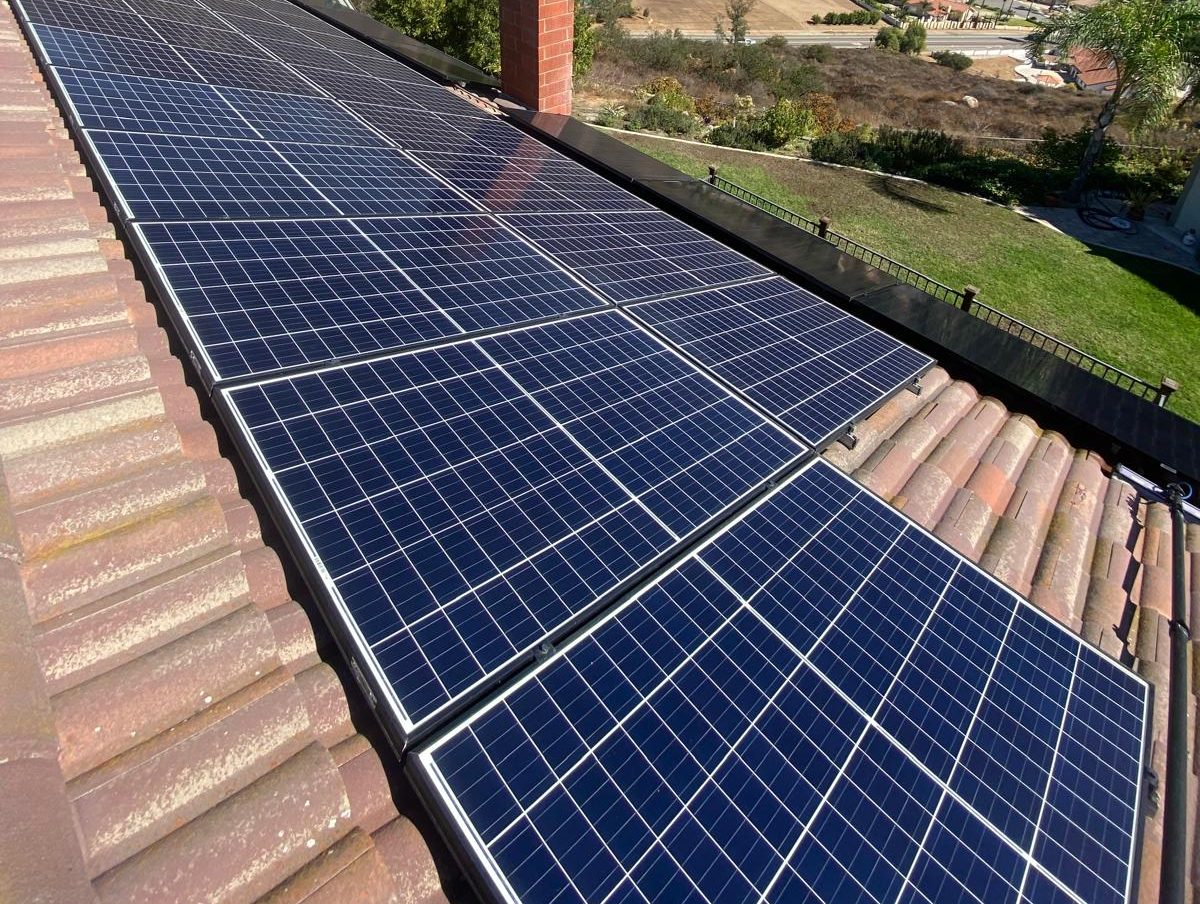 Clean solar panels on a San Diego tile roof after a Campista cleaning
